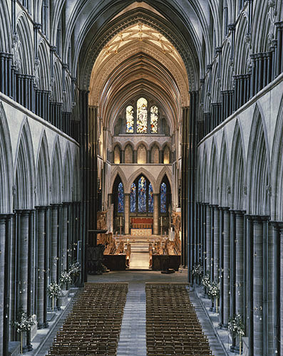 England, Salisbury Cathedral, Nave and Choir and The Prisoners of Conscience Window beyond the Choir