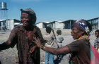 Kalahari Bushman and woman  at modern village